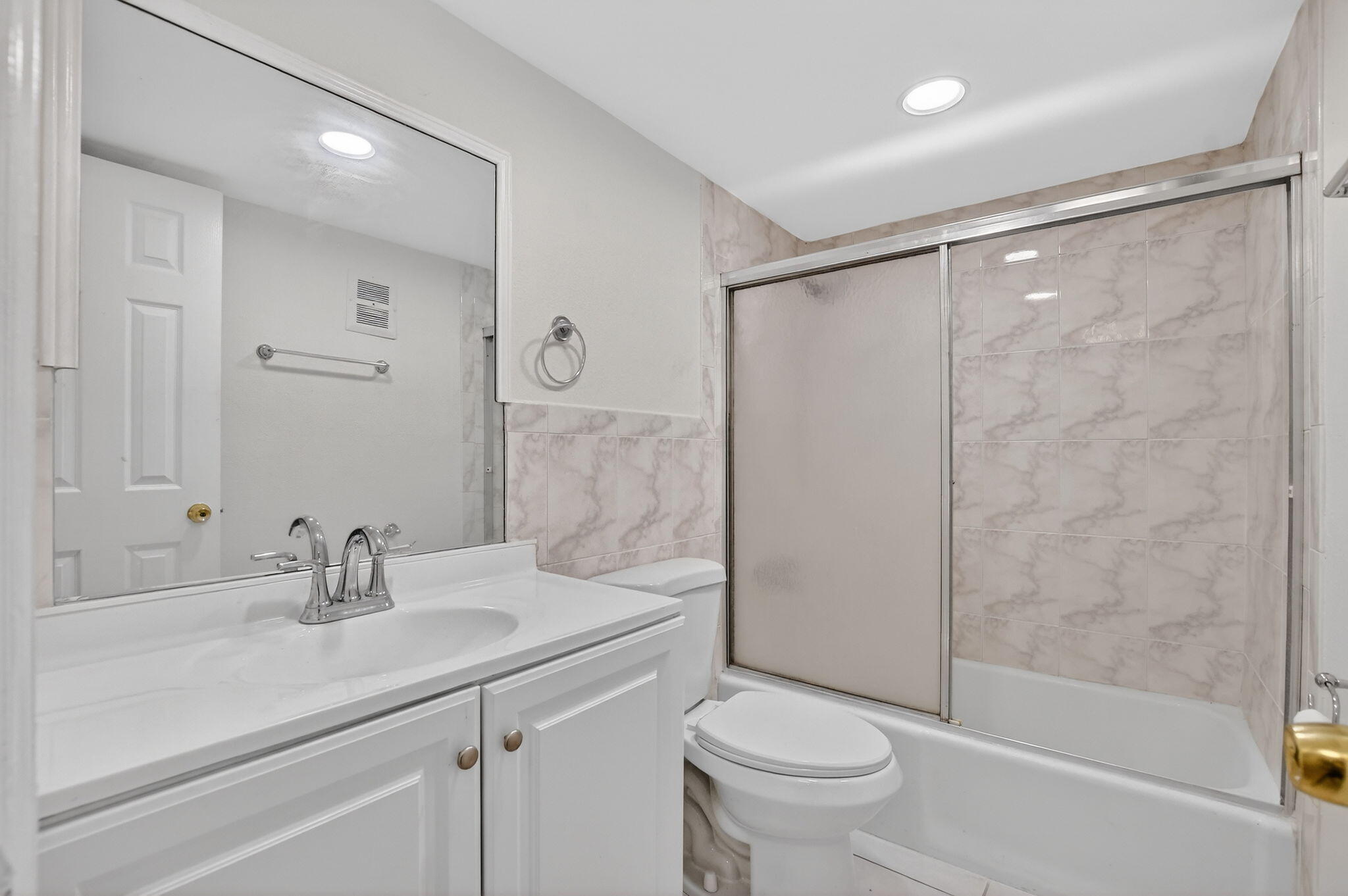 644 Northwest 13th Street, Unit 110 Boca Raton, FL 33486 - Photo 18 of 24 a bathroom with a sink toilet and shower