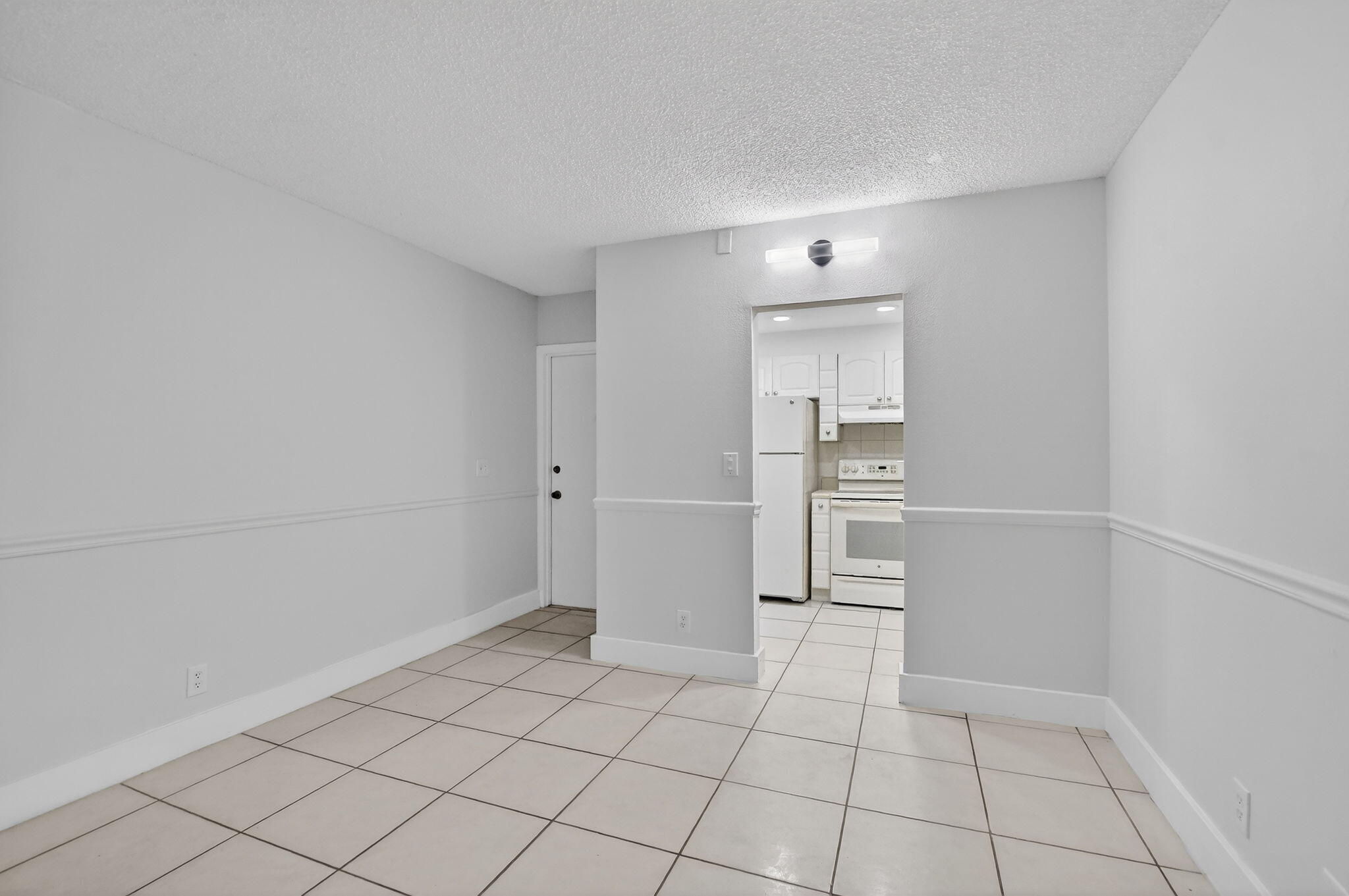 644 Northwest 13th Street, Unit 110 Boca Raton, FL 33486 - Photo 3 of 24 a view of an empty room and window