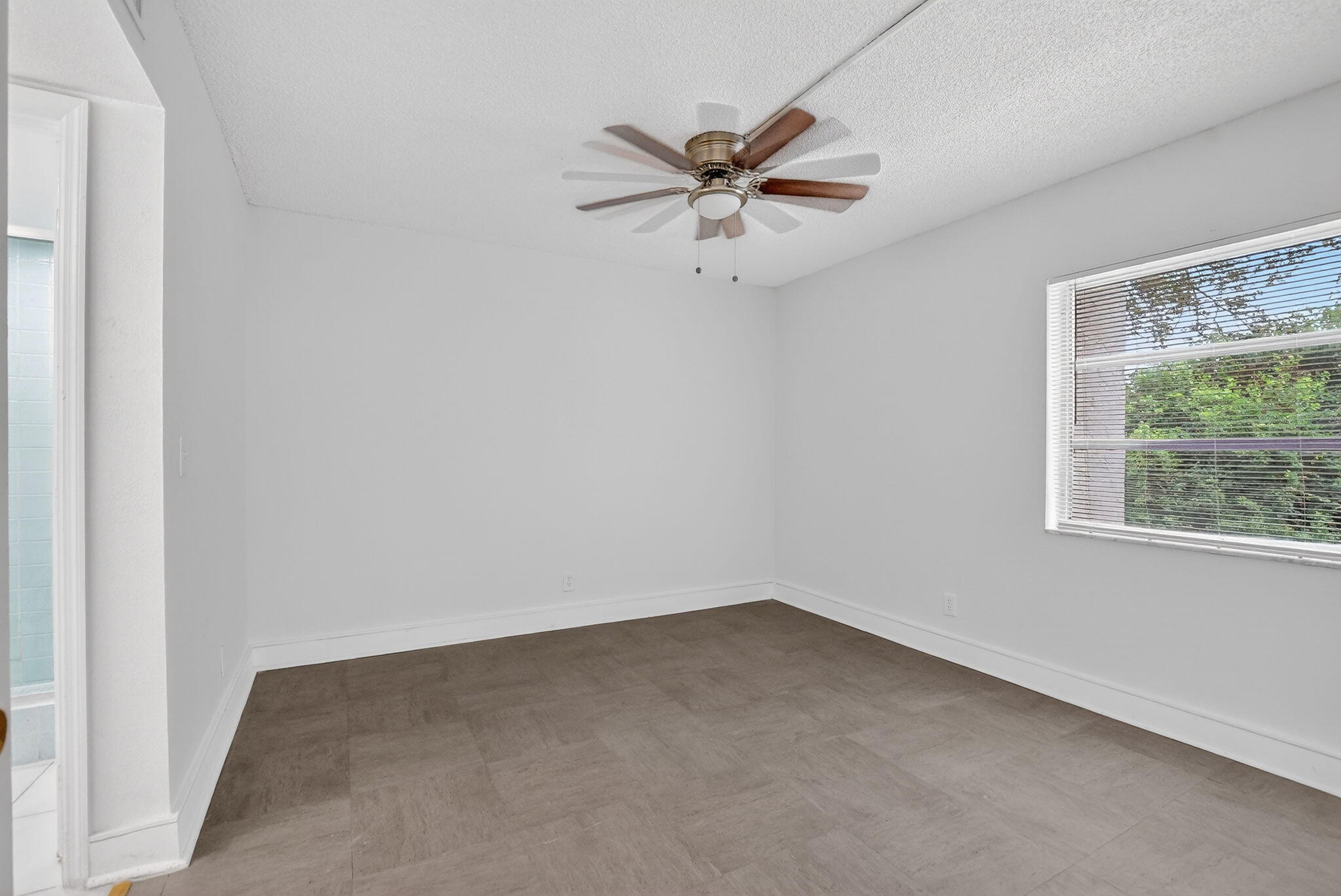 644 Northwest 13th Street, Unit 110 Boca Raton, FL 33486 - Photo 9 of 24 an empty room with a window