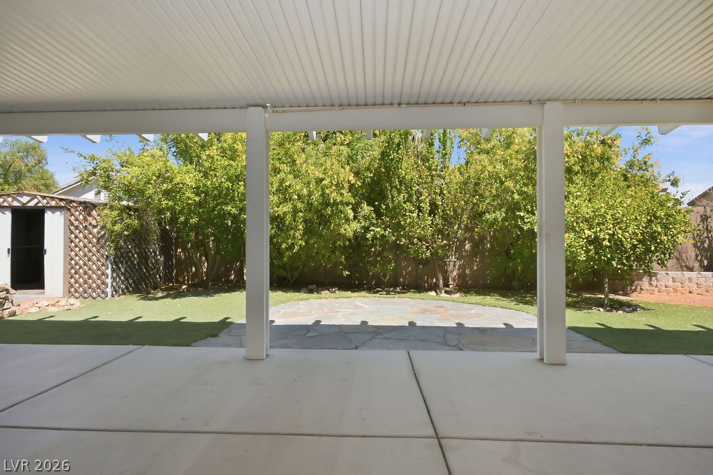 9712 North Running Rabbit Street Las Vegas, NV 89143 - Photo 13 of 42 A spacious covered patio provides a delightful outdoor living space.
