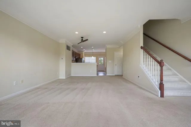 a view of a hallway with staircase