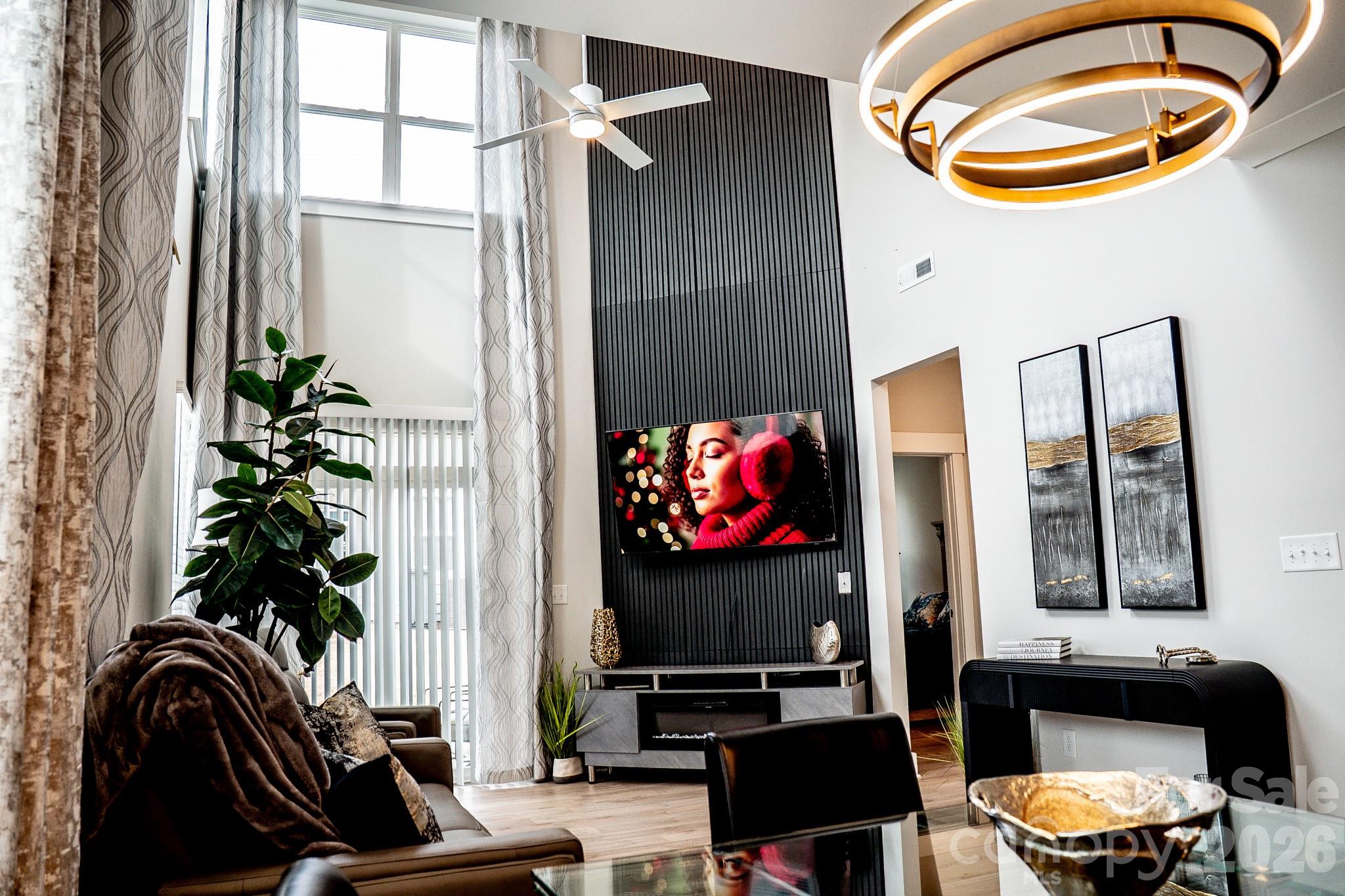 6288 Culbert Street Harrisburg, NC 28075 - Photo 11 of 40 a living room with furniture and a potted plant