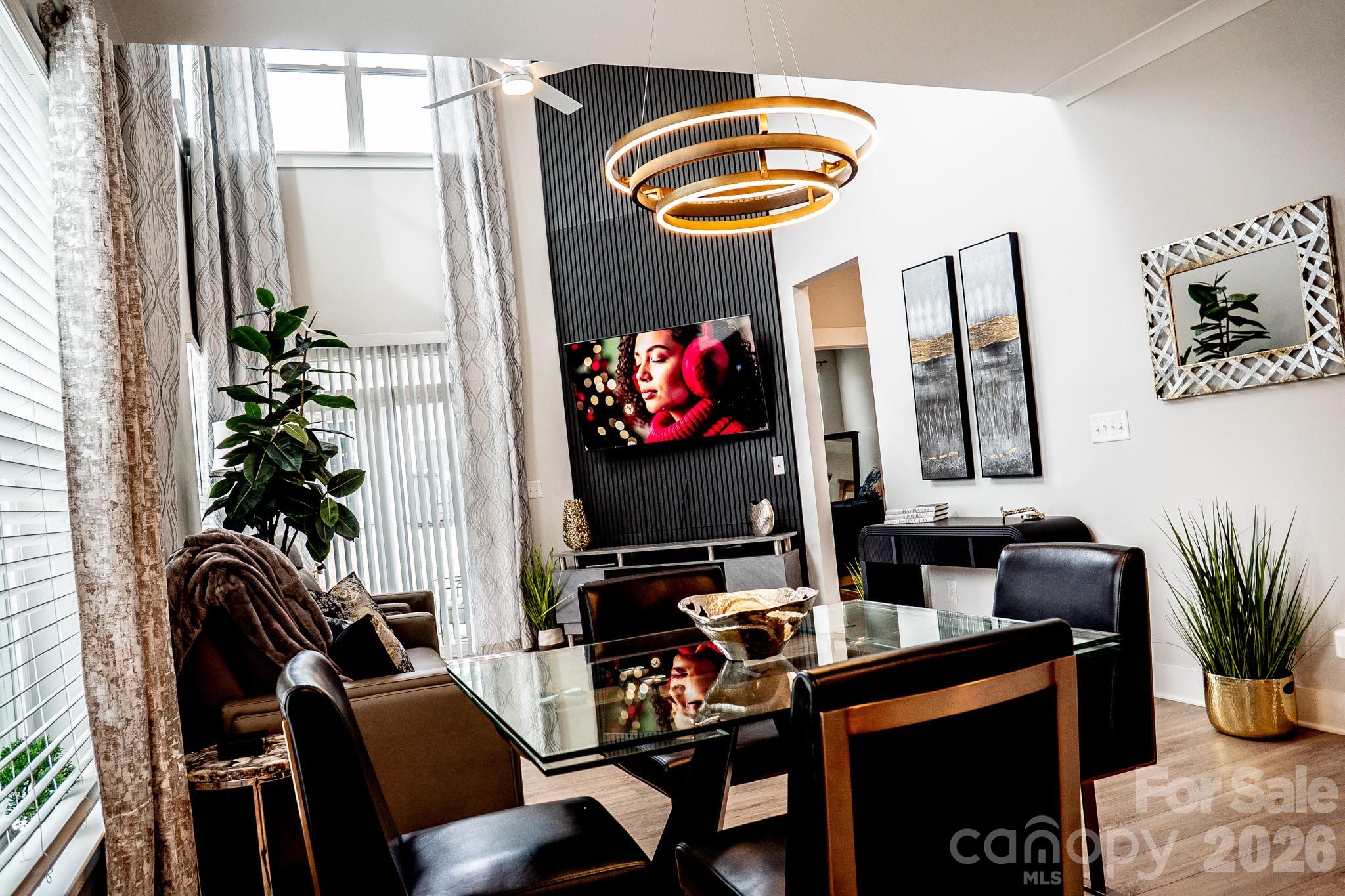 6288 Culbert Street Harrisburg, NC 28075 - Photo 12 of 40 a dining room with furniture and chandelier
