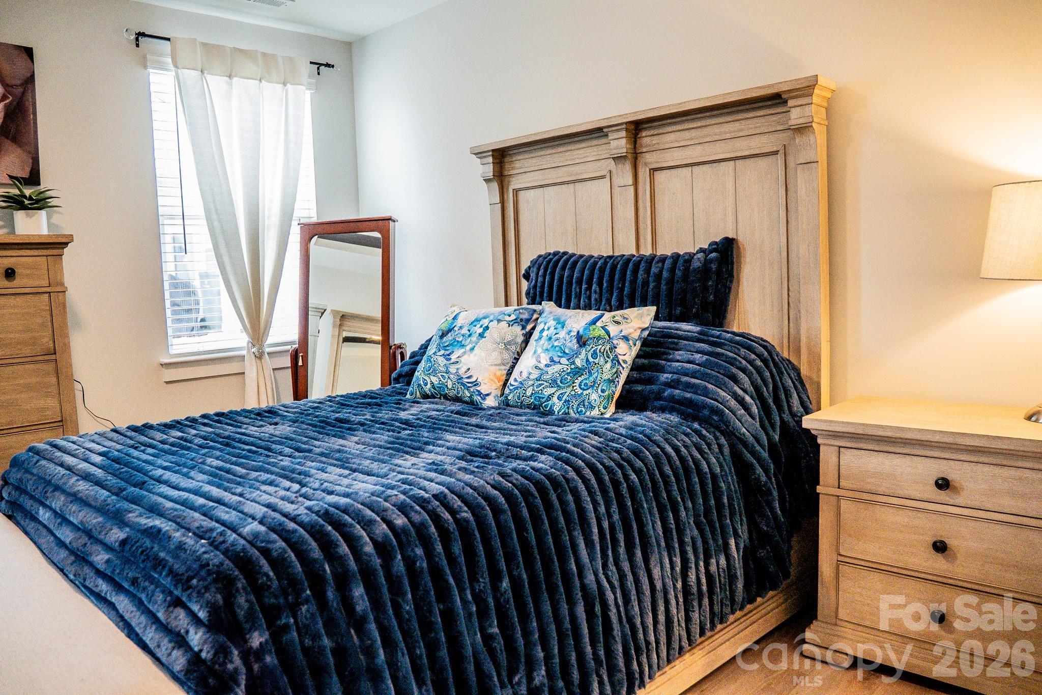 6288 Culbert Street Harrisburg, NC 28075 - Photo 13 of 40 a bedroom with a bed and a window