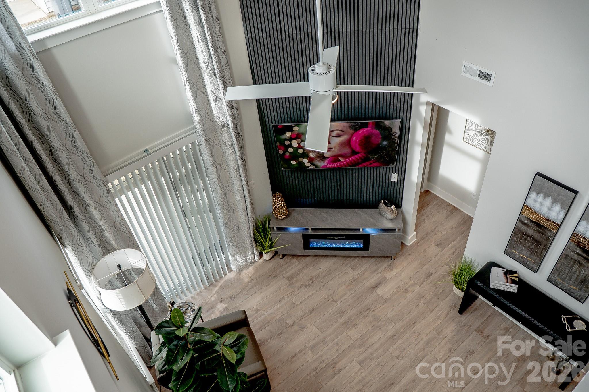 6288 Culbert Street Harrisburg, NC 28075 - Photo 25 of 40 a living room with furniture and a wooden floor