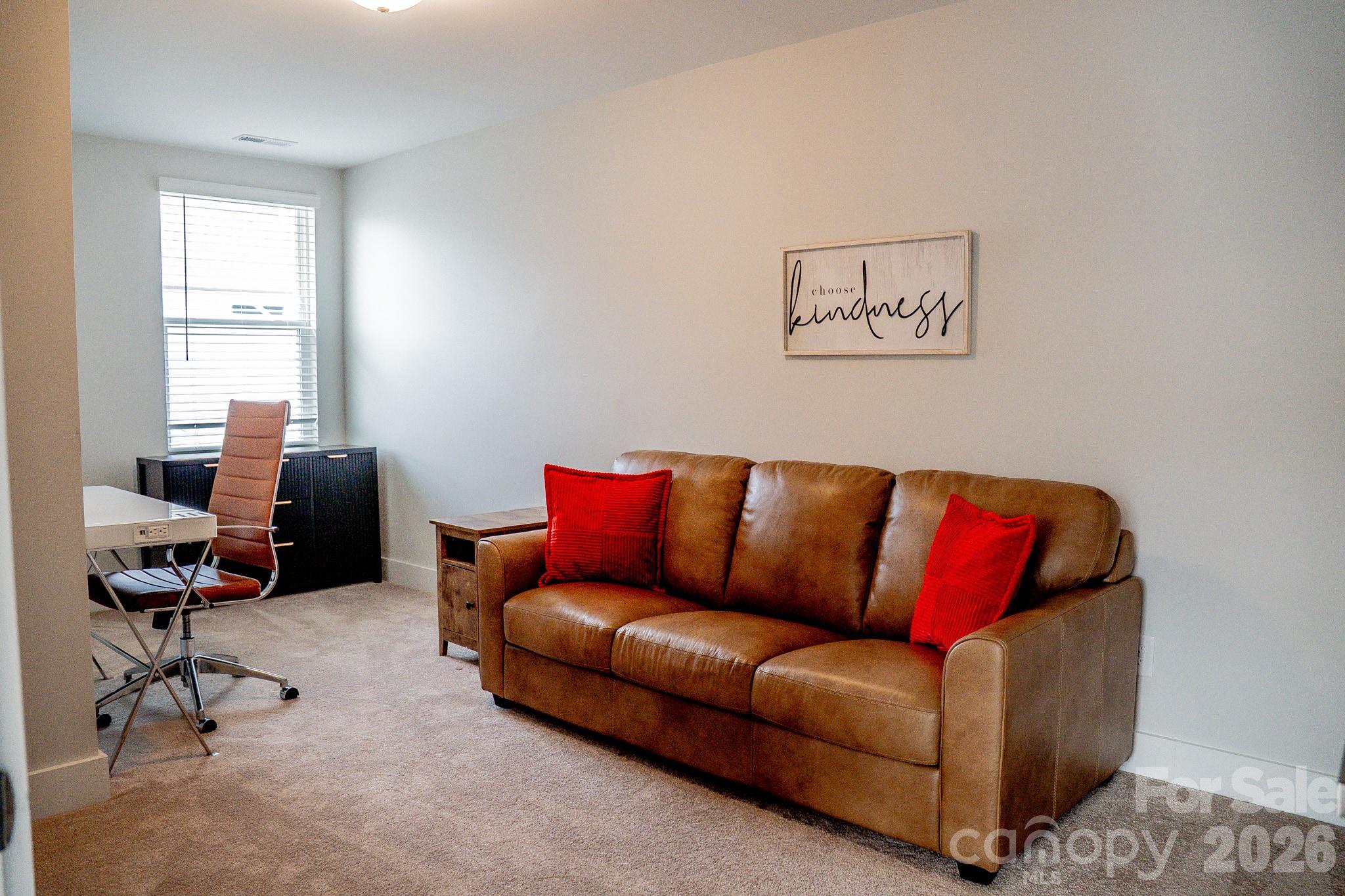 6288 Culbert Street Harrisburg, NC 28075 - Photo 29 of 40 a living room with furniture and a window
