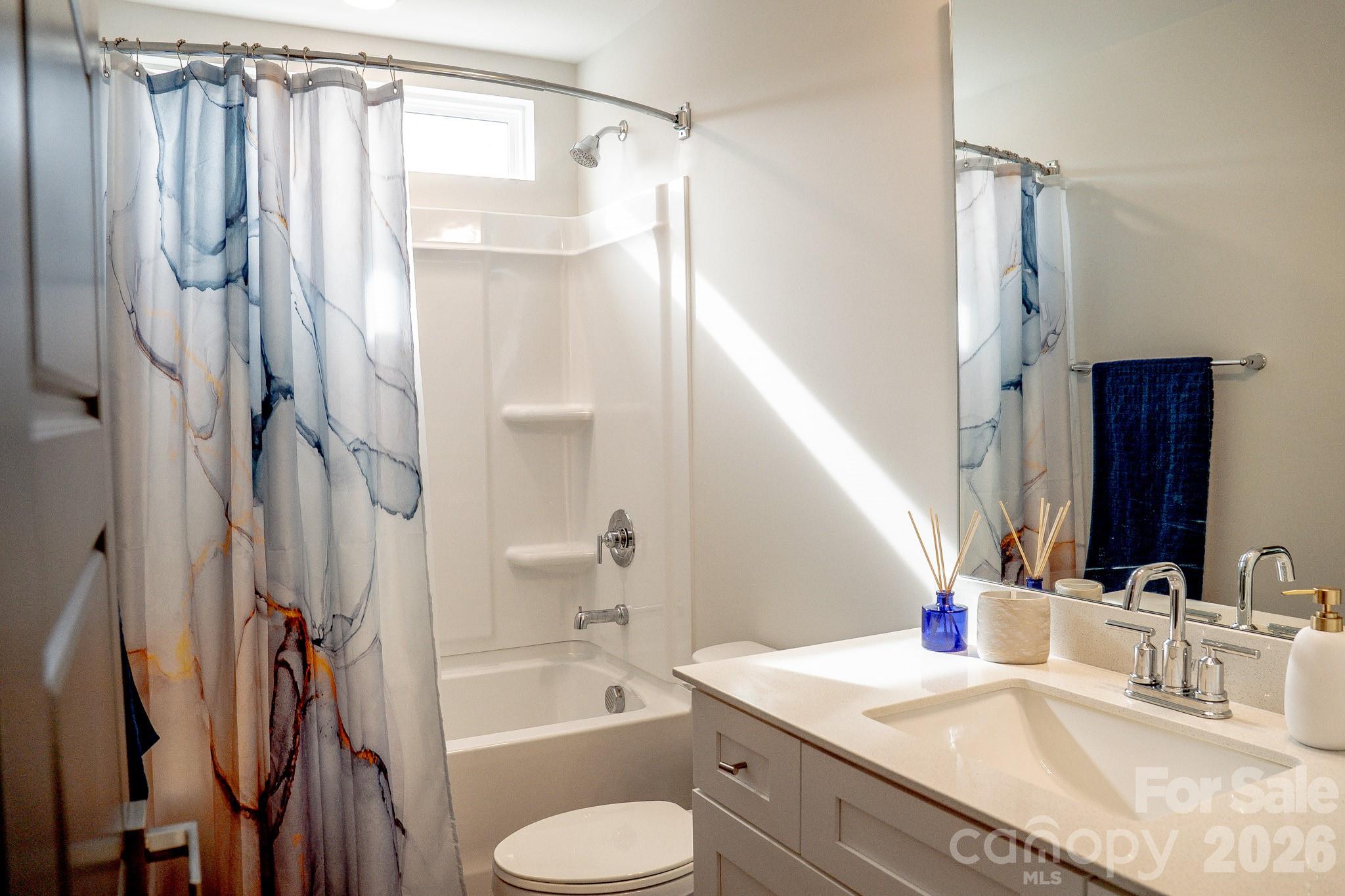 6288 Culbert Street Harrisburg, NC 28075 - Photo 30 of 40 a bathroom with a granite countertop sink toilet and shower