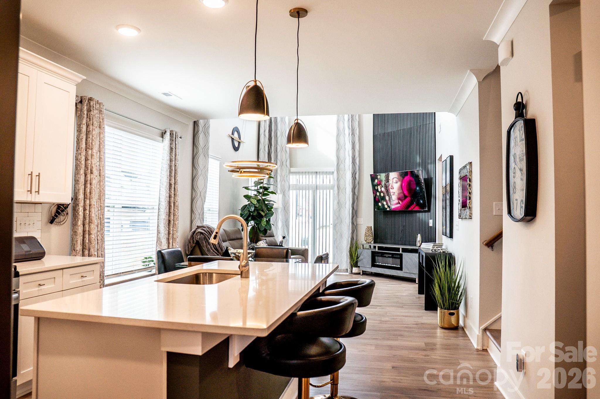 6288 Culbert Street Harrisburg, NC 28075 - Photo 3 of 40 a view of a living room and dining room