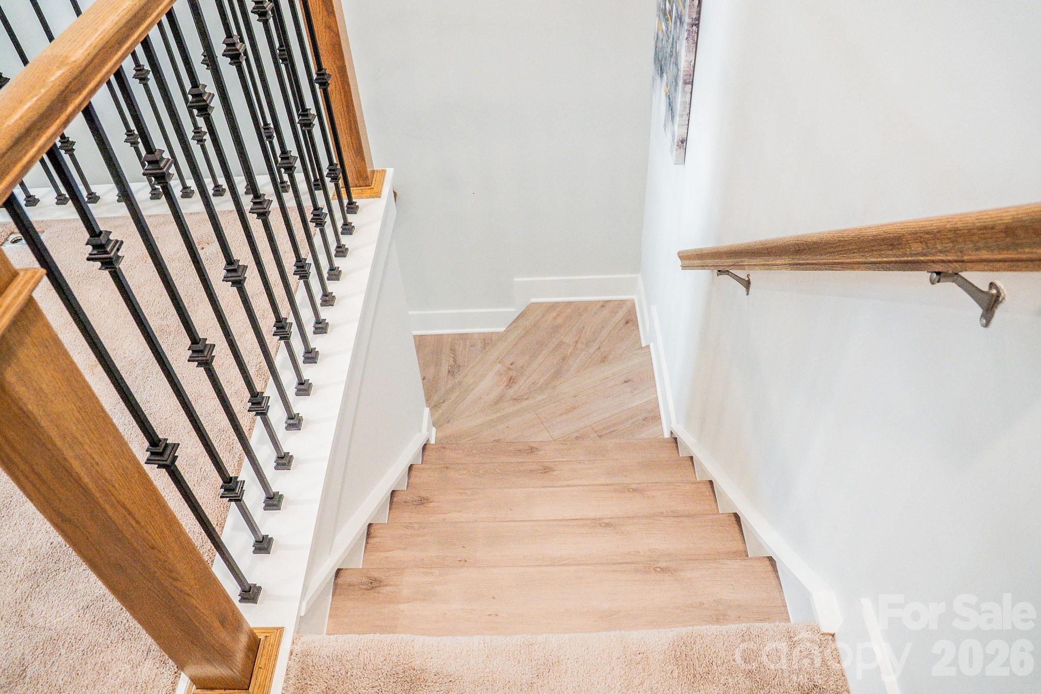 6288 Culbert Street Harrisburg, NC 28075 - Photo 31 of 40 a view of staircase with white walls