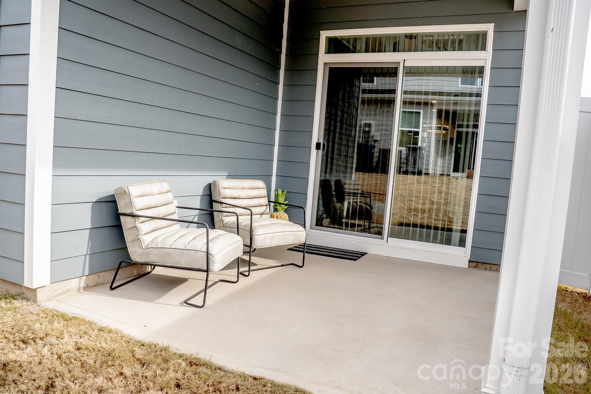 6288 Culbert Street Harrisburg, NC 28075 - Photo 36 of 40 a view of a two chairs in the balcony