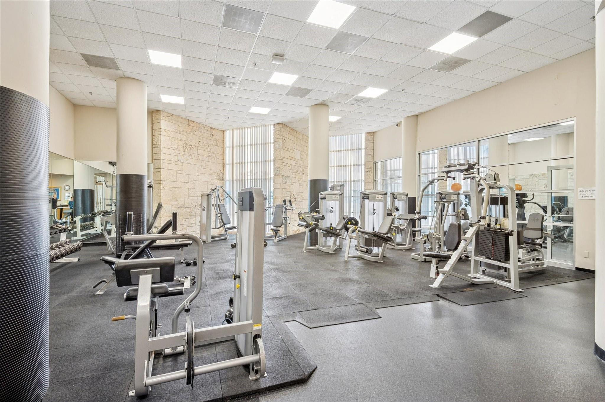 5151 Collins Avenue, Unit 520 Miami Beach, FL 33140 - Photo 13 of 14 a view of a room with gym equipment