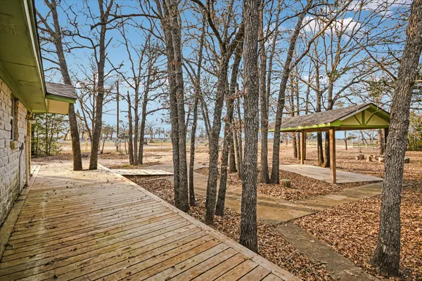 a view of a pathway with a yard