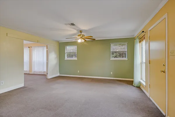 a view of an empty room with a window
