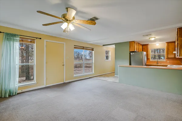 a view of an empty room with a window