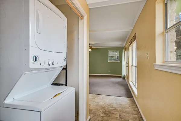 a view of a hallway with workspace and entryway