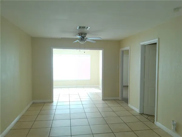 a view of an empty room and window