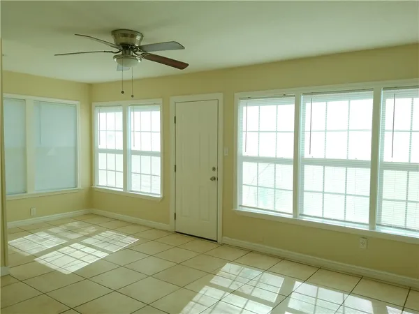 a view of an empty room and window