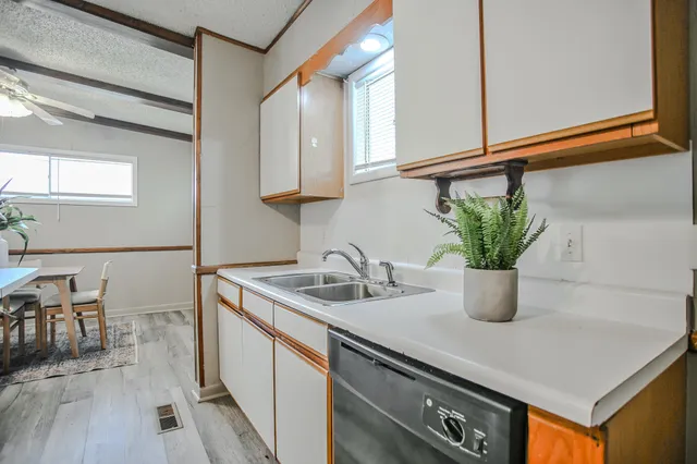 a kitchen with a sink and a window