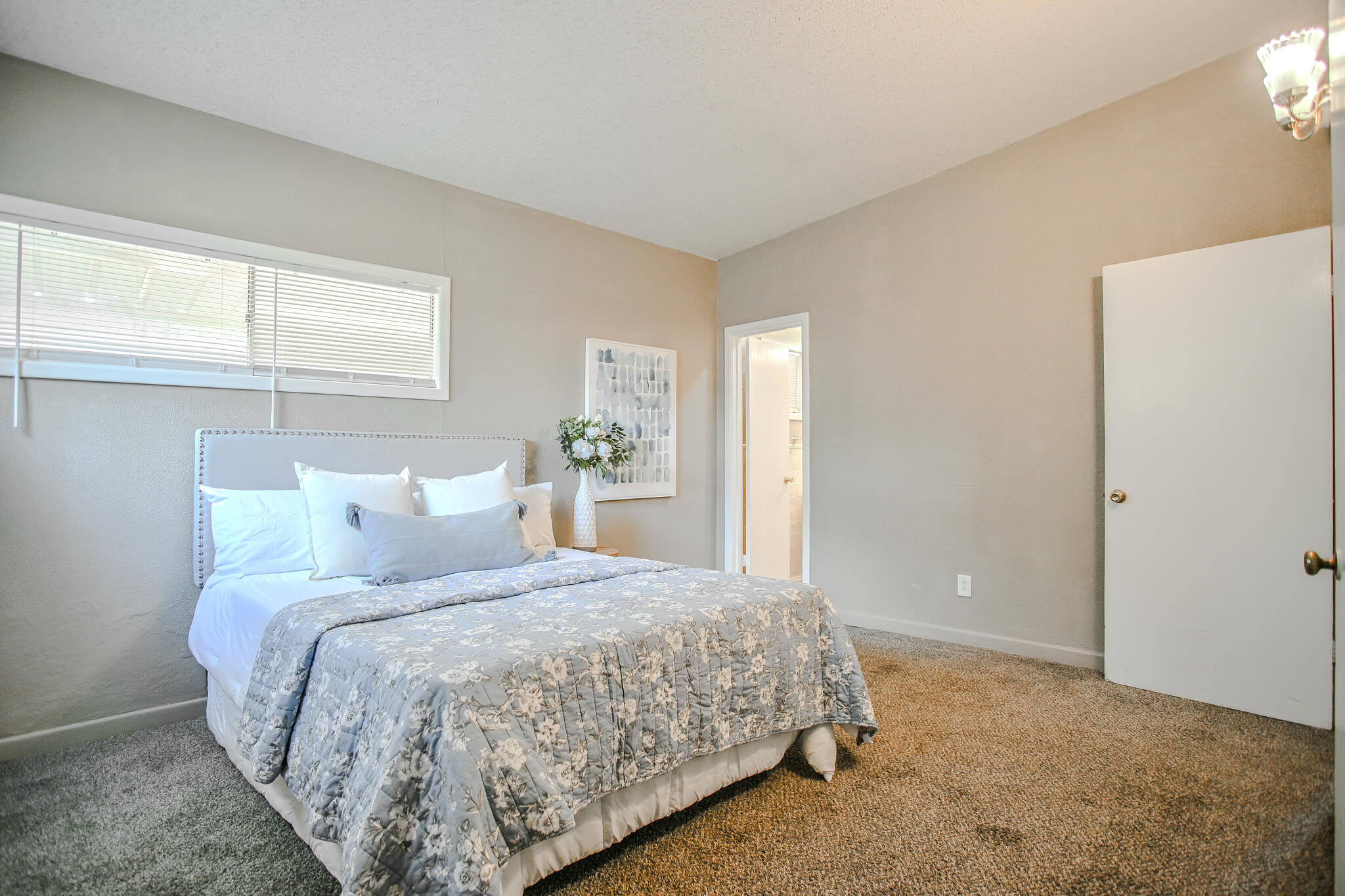 4405 44th Street Lubbock, TX 79414 - Photo 16 of 28 a bedroom with a bed and a window