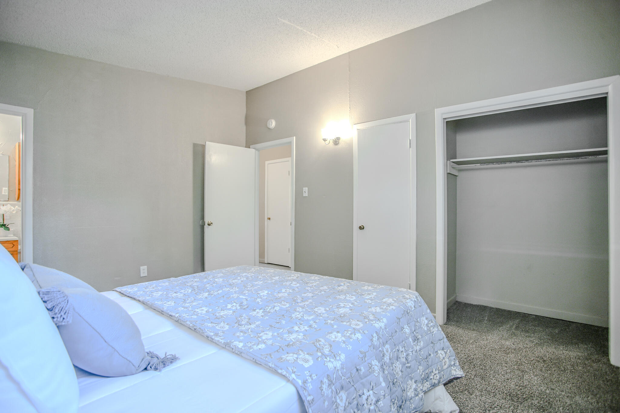 4405 44th Street Lubbock, TX 79414 - Photo 17 of 28 a bedroom with a bed and a cabinets