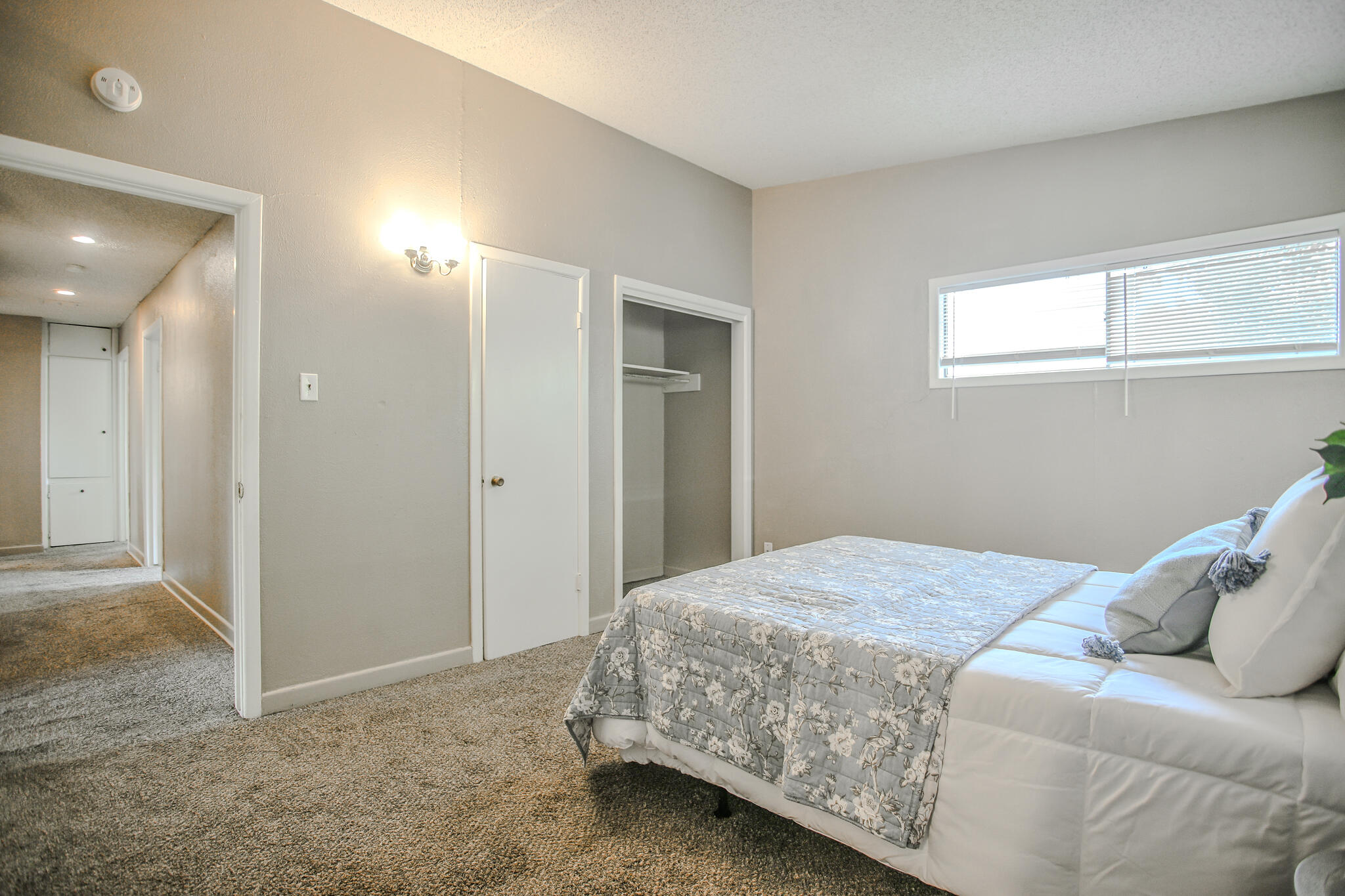 4405 44th Street Lubbock, TX 79414 - Photo 18 of 28 a bedroom with a bed and a window