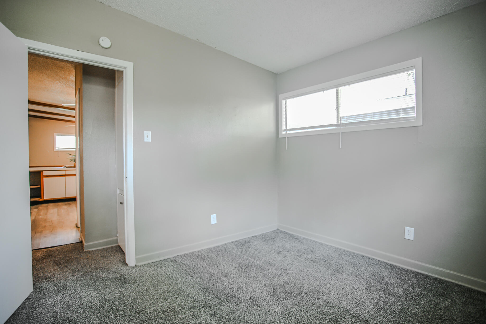 4405 44th Street Lubbock, TX 79414 - Photo 23 of 28 an empty room with windows and entrance