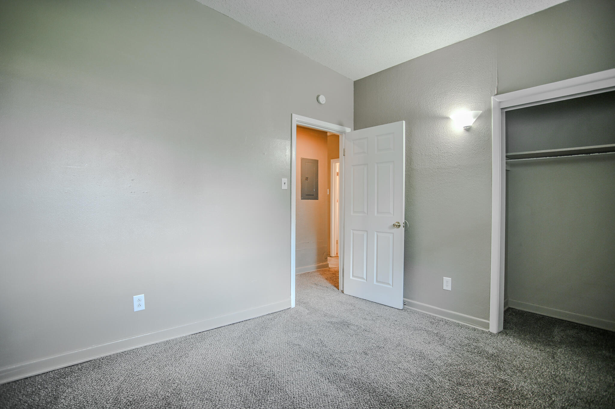 4405 44th Street Lubbock, TX 79414 - Photo 26 of 28 an empty room with closet and wooden door