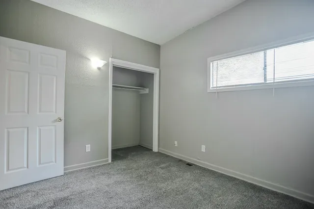 a bathroom with a sink toilet and window