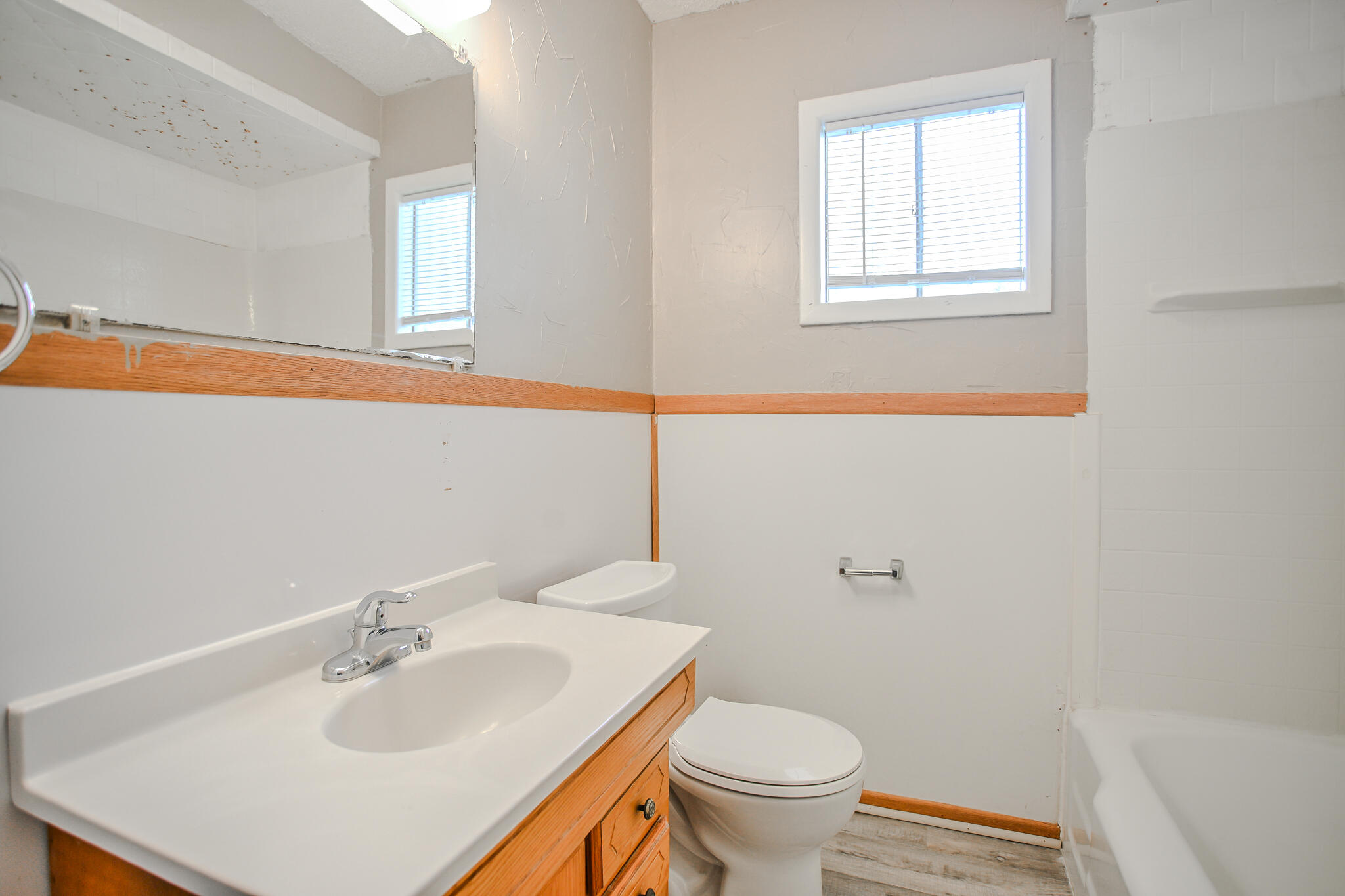 4405 44th Street Lubbock, TX 79414 - Photo 28 of 28 a bathroom with a sink toilet and window