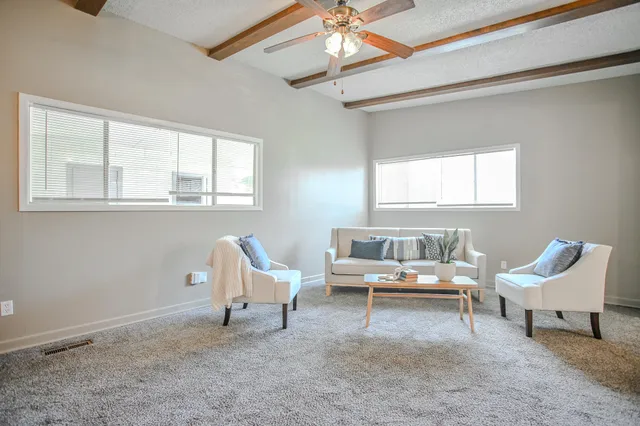 a living room with furniture and a window