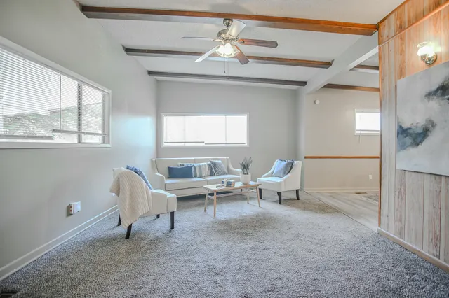 a living room with furniture and a window