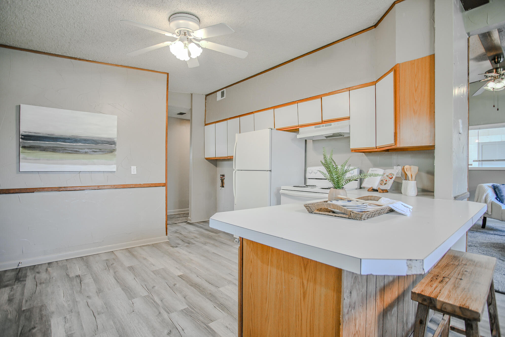 4405 44th Street Lubbock, TX 79414 - Photo 10 of 28 a kitchen with a table and chairs