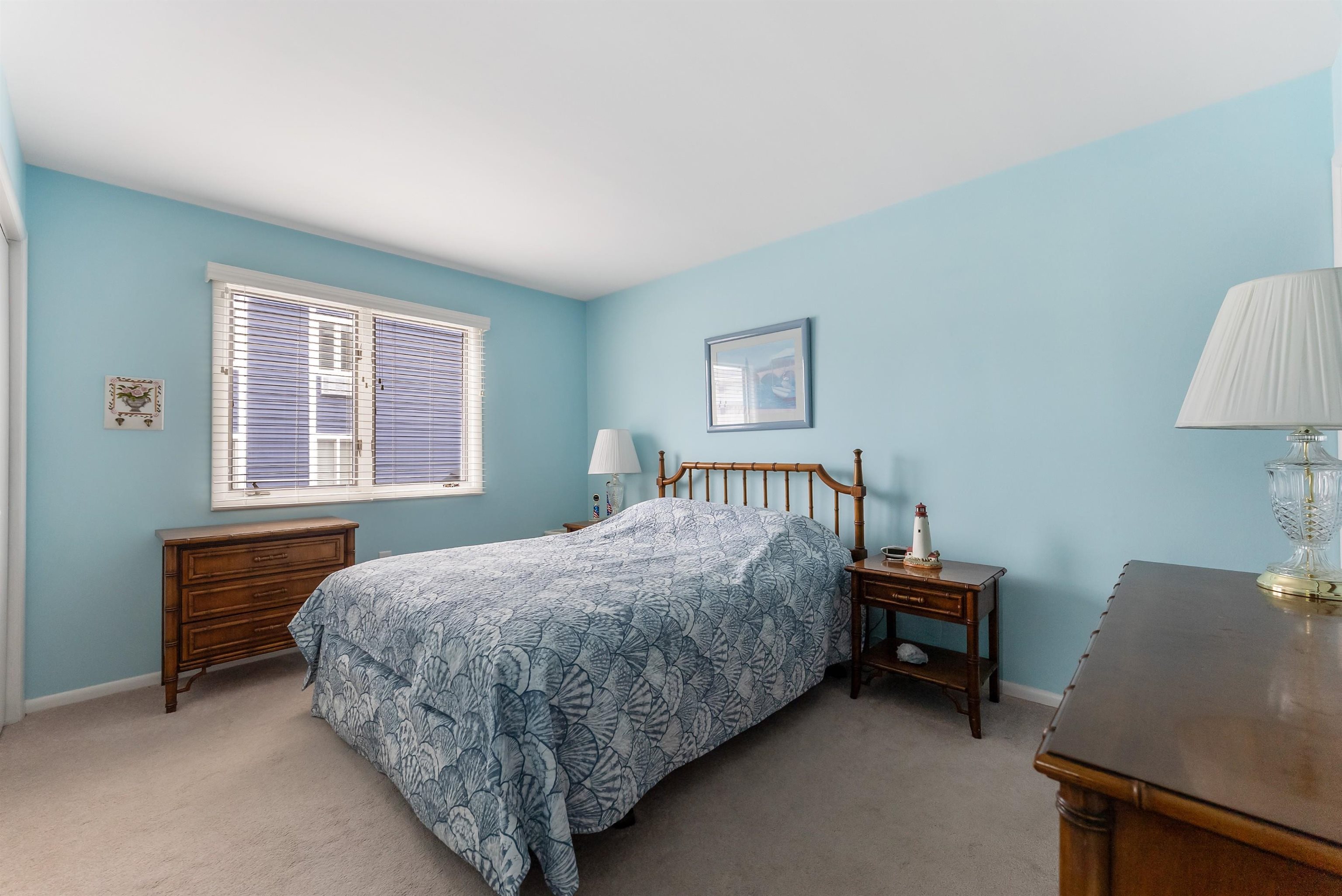 280 79th Street, Unit 1 Avalon, NJ 08202 - Photo 14 of 21 a bedroom with a bed and a window