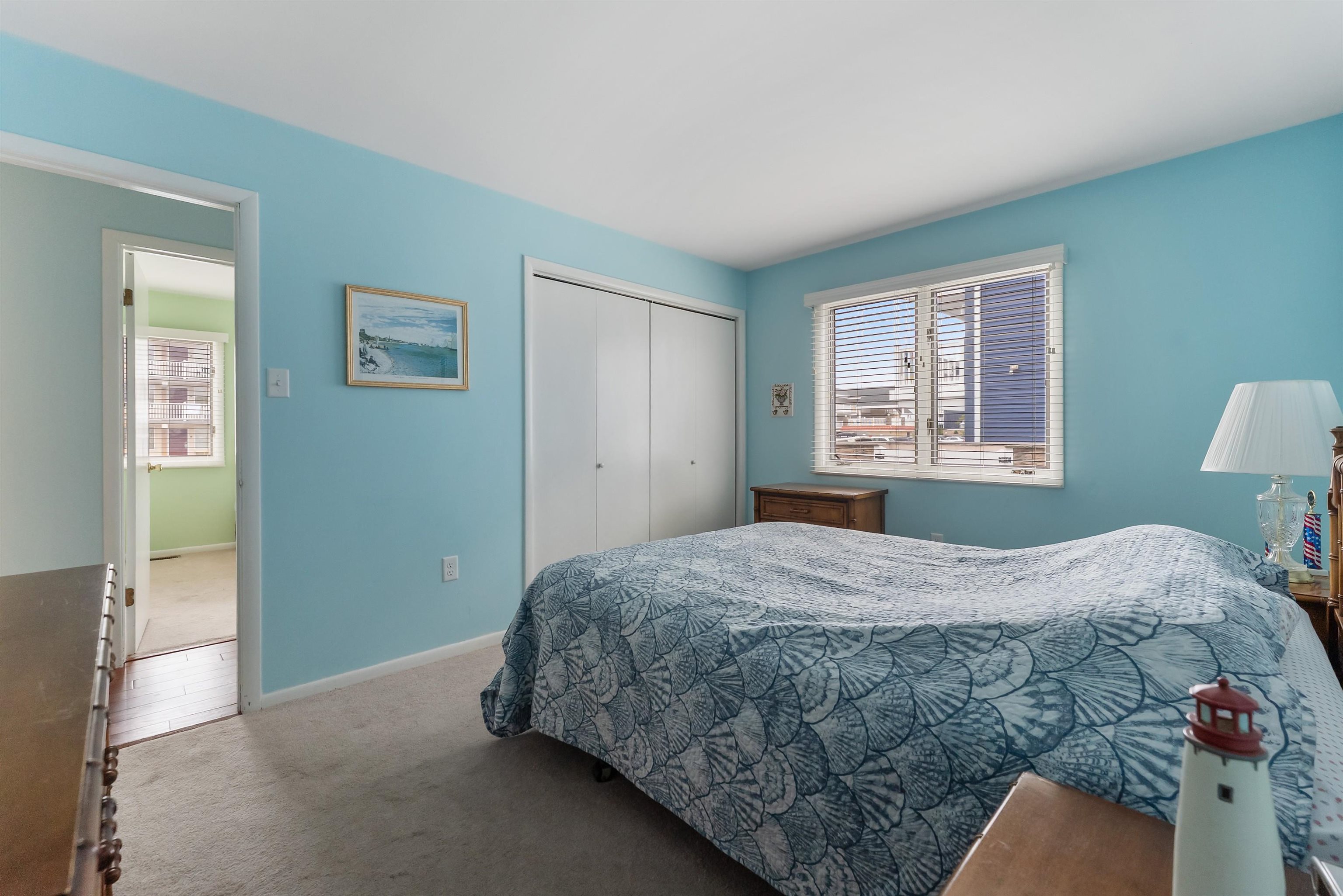 280 79th Street, Unit 1 Avalon, NJ 08202 - Photo 15 of 21 a bedroom with a bed and a window