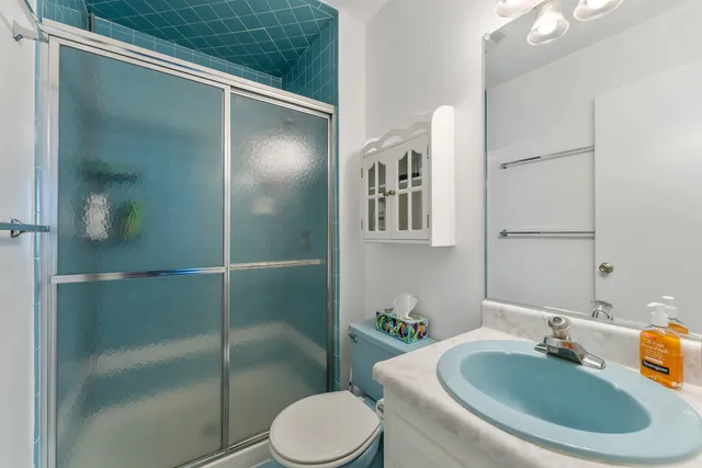 a bathroom with a sink and toilet