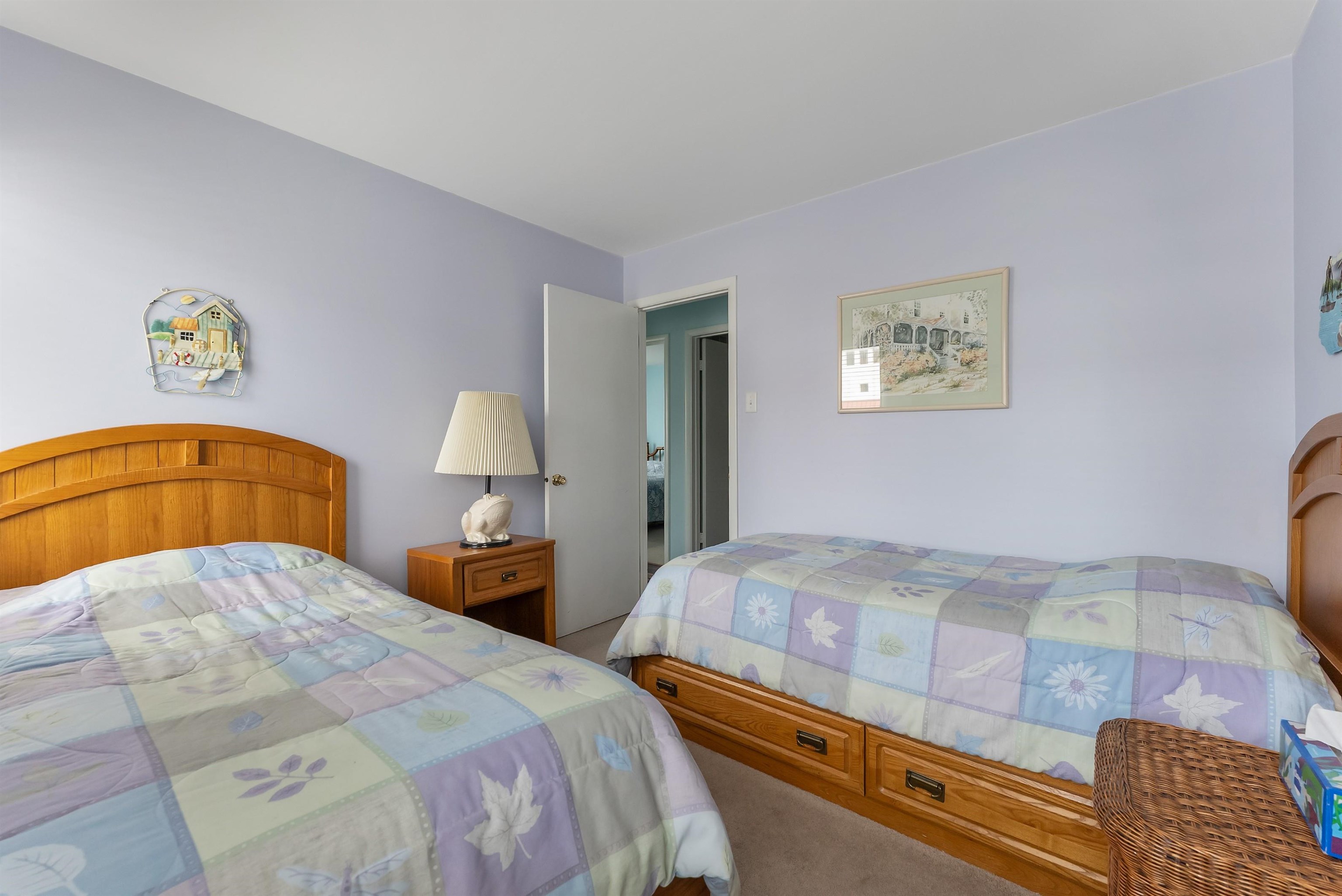 280 79th Street, Unit 1 Avalon, NJ 08202 - Photo 18 of 21 a bedroom with a bed and dresser
