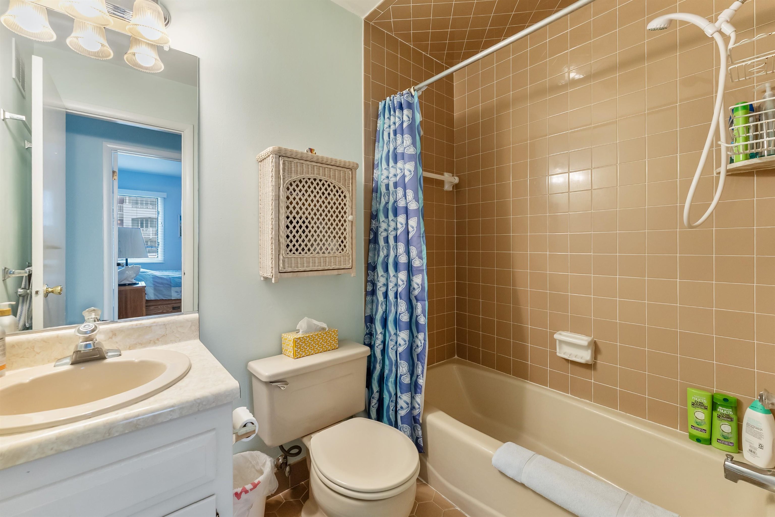 280 79th Street, Unit 1 Avalon, NJ 08202 - Photo 20 of 21 a bathroom with a sink a toilet and shower