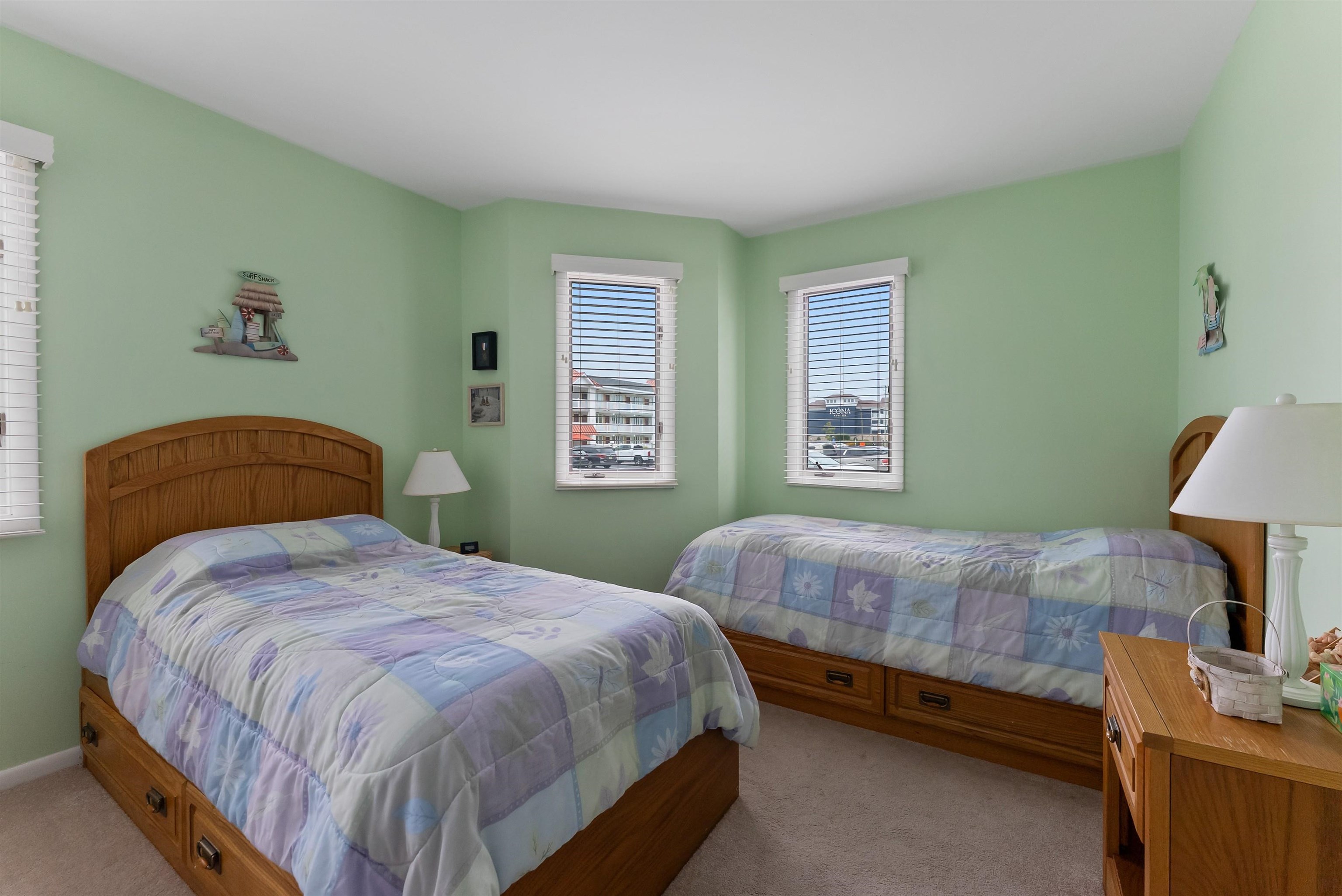 280 79th Street, Unit 1 Avalon, NJ 08202 - Photo 6 of 21 a bedroom with a bed and a lamp on dresser