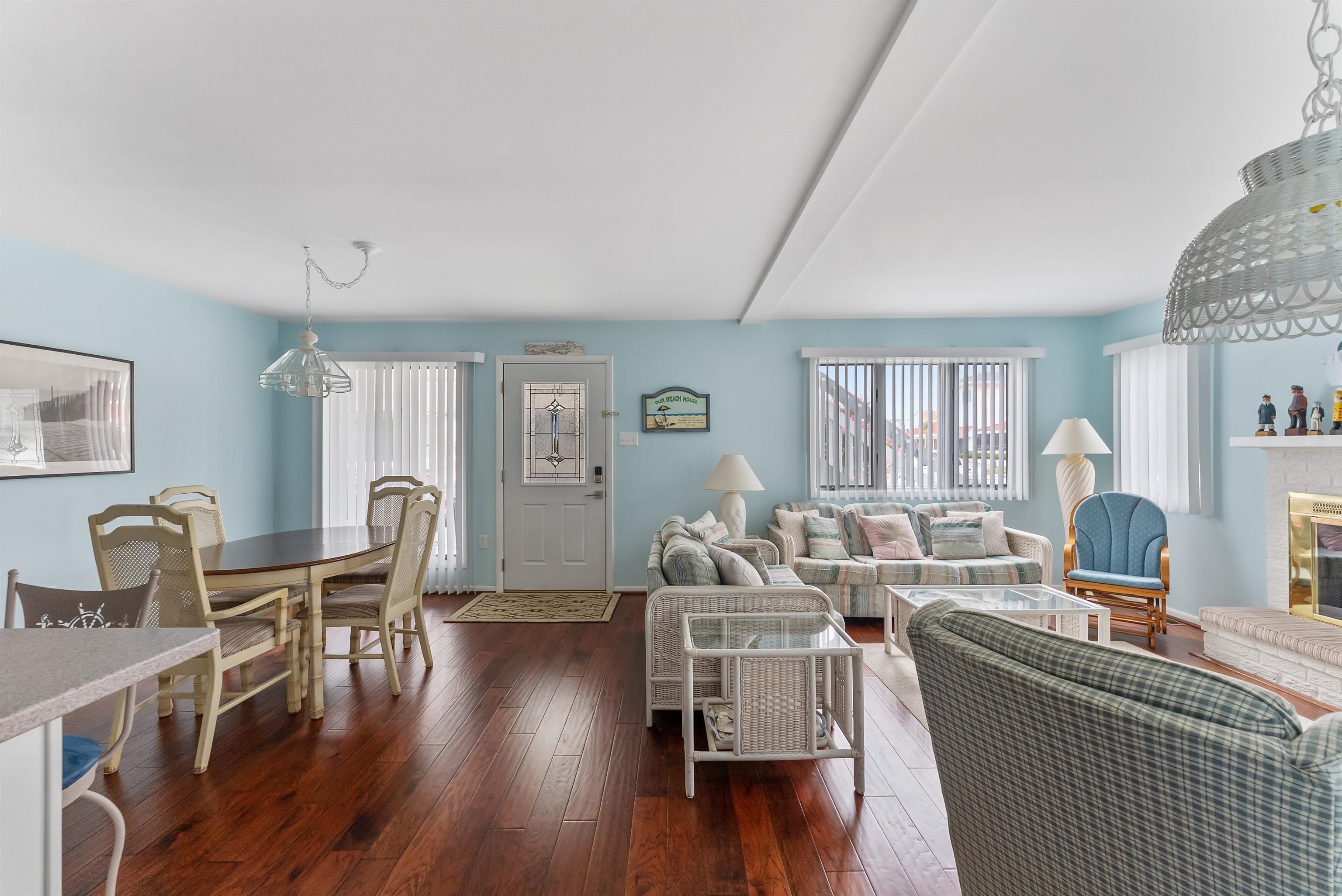 280 79th Street, Unit 1 Avalon, NJ 08202 - Photo 7 of 21 a living room with furniture a wooden floor and next to a window