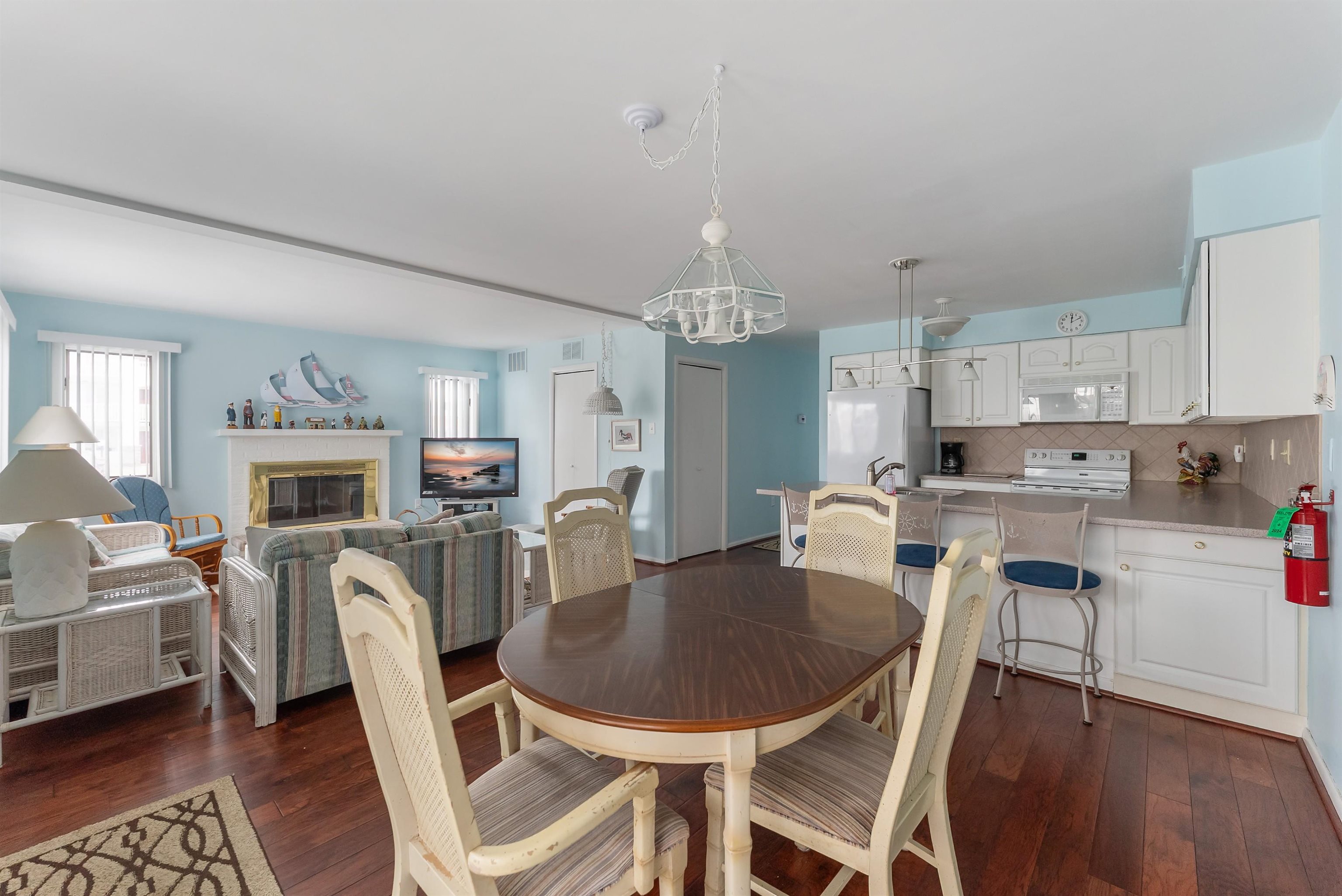 280 79th Street, Unit 1 Avalon, NJ 08202 - Photo 8 of 21 a view of kitchen with dining table and chairs