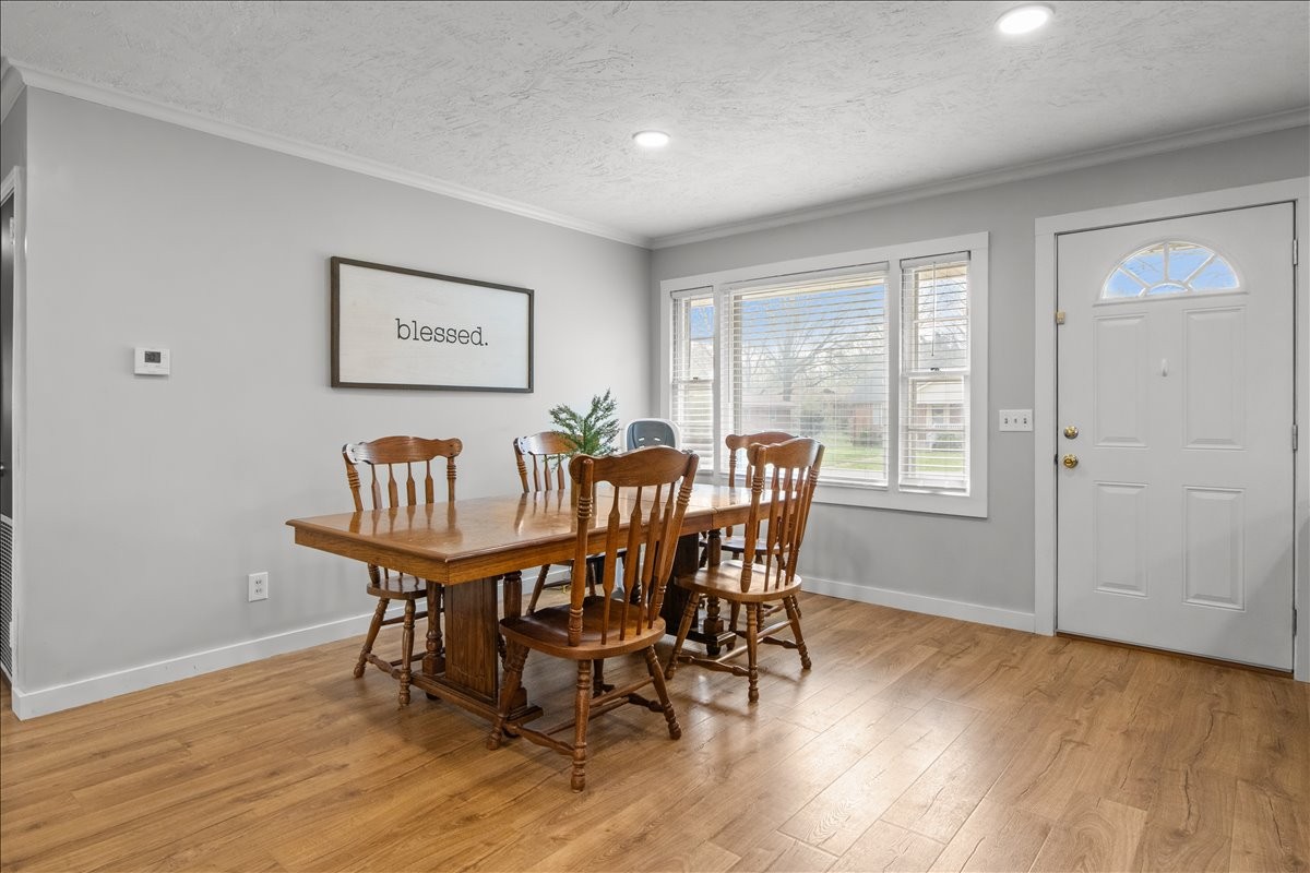 1112 Bridgette Street Paris, TN 38242 - Photo 12 of 34 a view of a dining room with furniture window and wooden floor