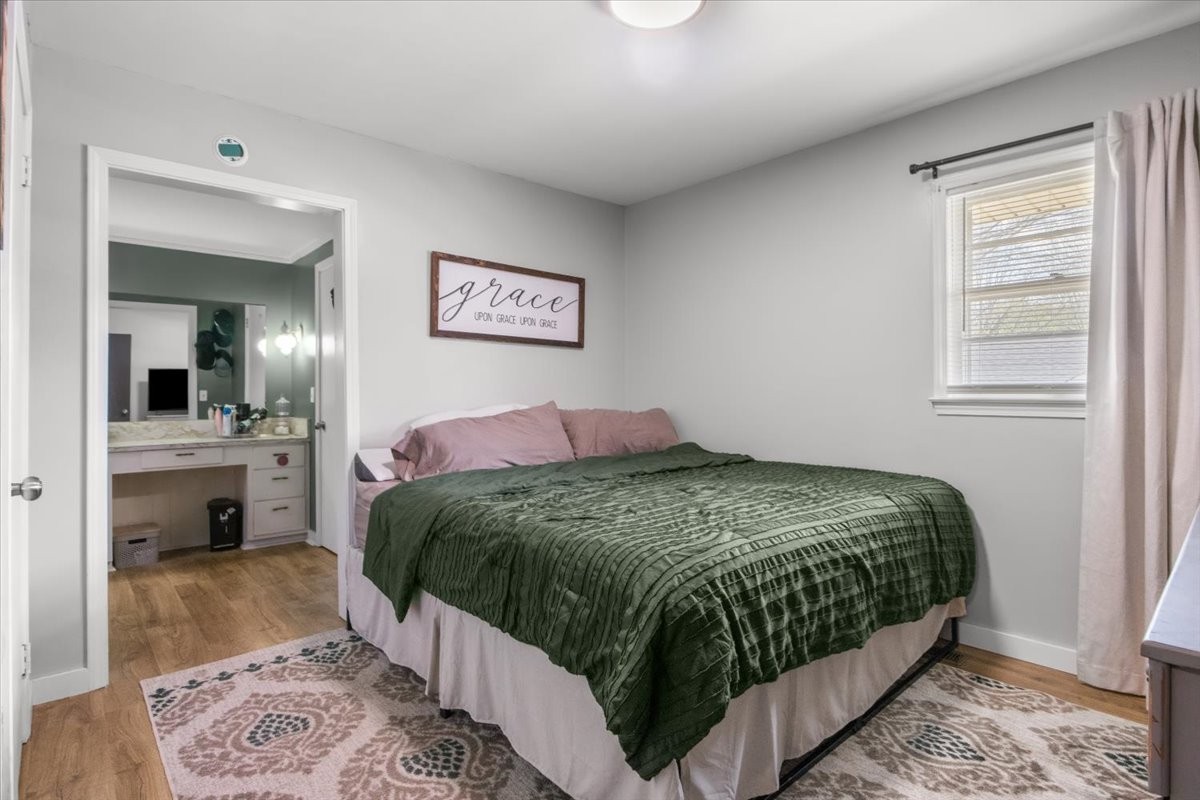 1112 Bridgette Street Paris, TN 38242 - Photo 14 of 34 a bedroom with a bed and a view of kitchen