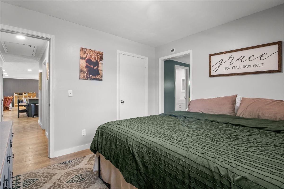 1112 Bridgette Street Paris, TN 38242 - Photo 15 of 34 a bedroom with a bed and painting on the wall