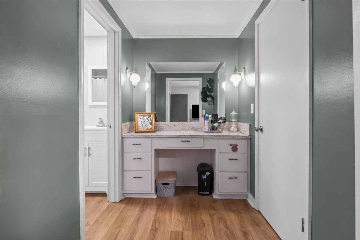 1112 Bridgette Street Paris, TN 38242 - Photo 17 of 34 a view of a bathroom with a sink mirror and wooden floor