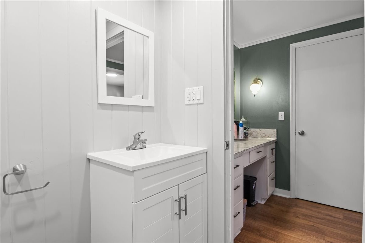 1112 Bridgette Street Paris, TN 38242 - Photo 18 of 34 a bathroom with a sink a vanity and a mirror