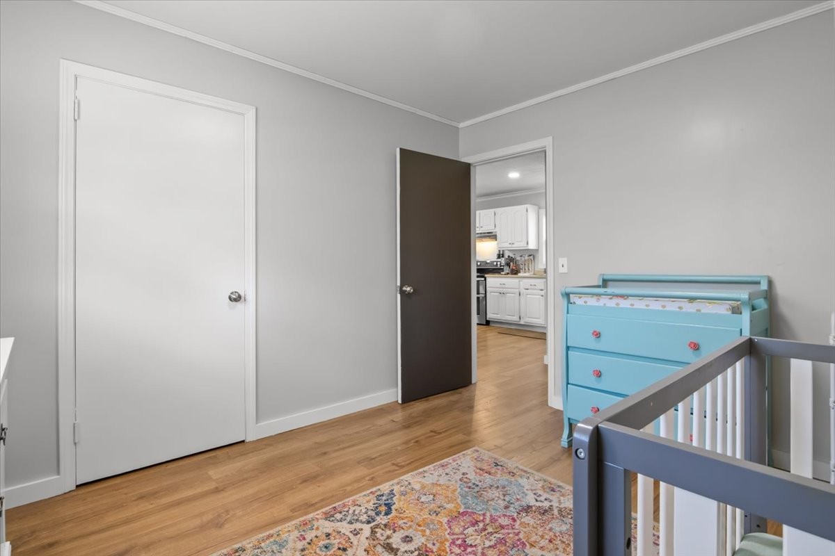 1112 Bridgette Street Paris, TN 38242 - Photo 25 of 34 a view of an empty room with closet and wooden floor