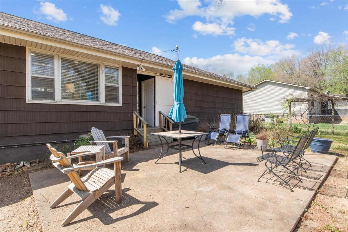 1112 Bridgette Street Paris, TN 38242 - Photo 28 of 34 a building outdoor space with patio furniture and potted plants