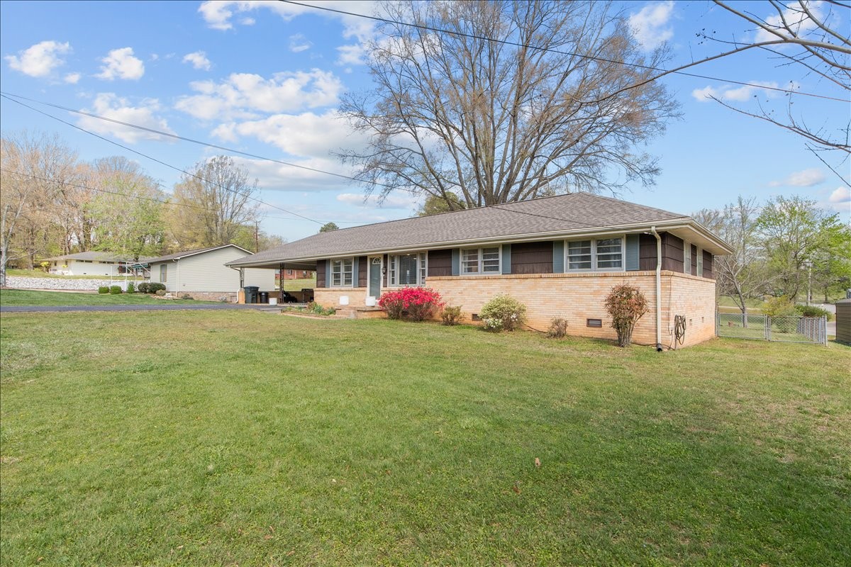 1112 Bridgette Street Paris, TN 38242 - Photo 34 of 34 a front view of house with yard and trees in the background