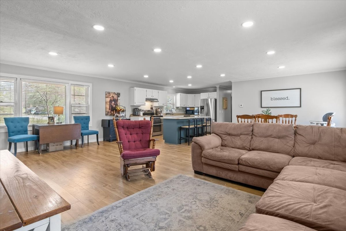 1112 Bridgette Street Paris, TN 38242 - Photo 5 of 34 a living room kitchen with a couch and a coffee table
