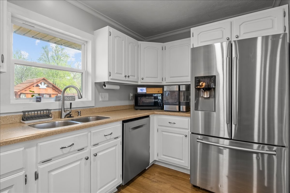 1112 Bridgette Street Paris, TN 38242 - Photo 10 of 34 a kitchen with appliances a sink and a window